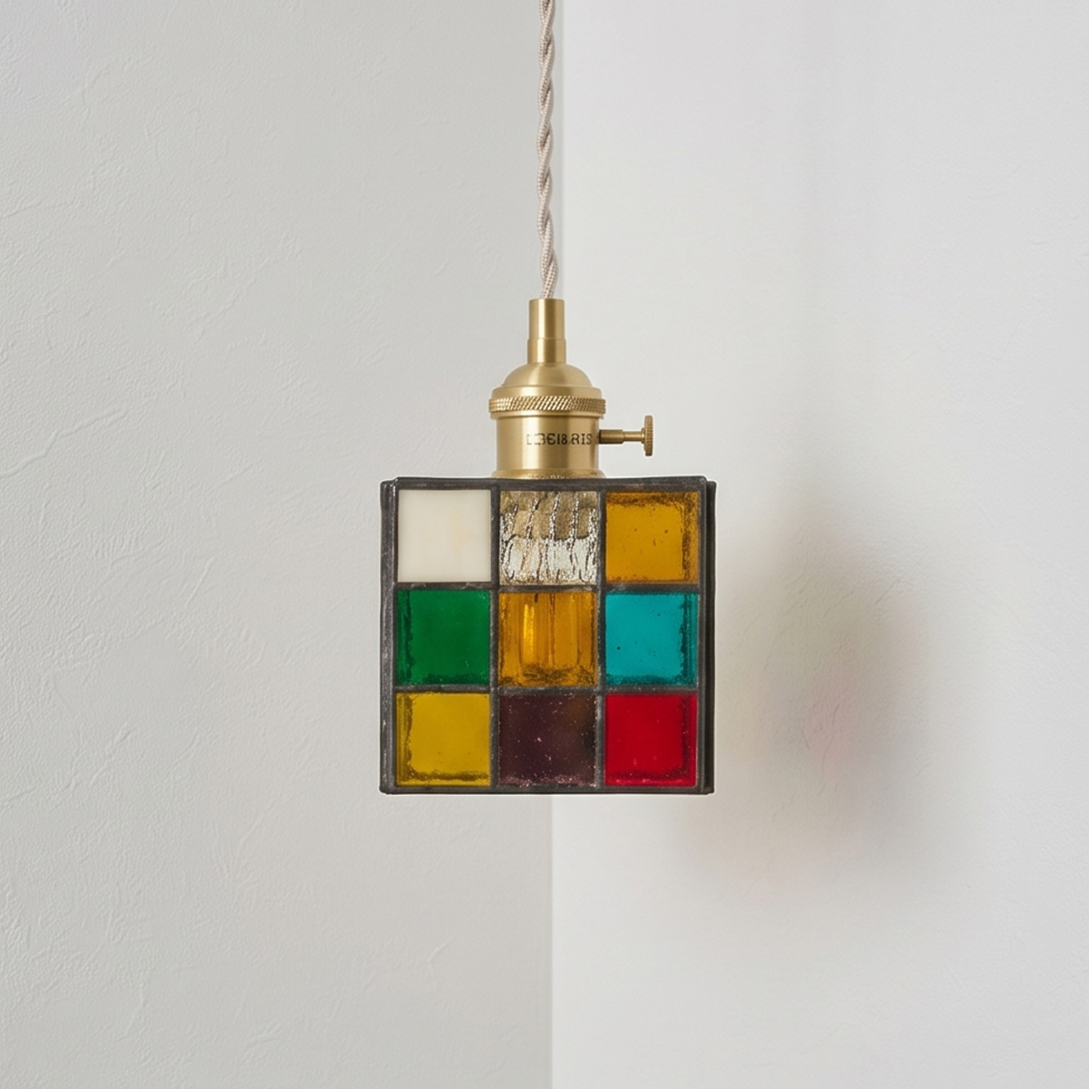Vintage Stained Glass Cube Pendant Light 7 Small colorful glass hanging lamp installed above a bistro table in a vintage-inspired dining space