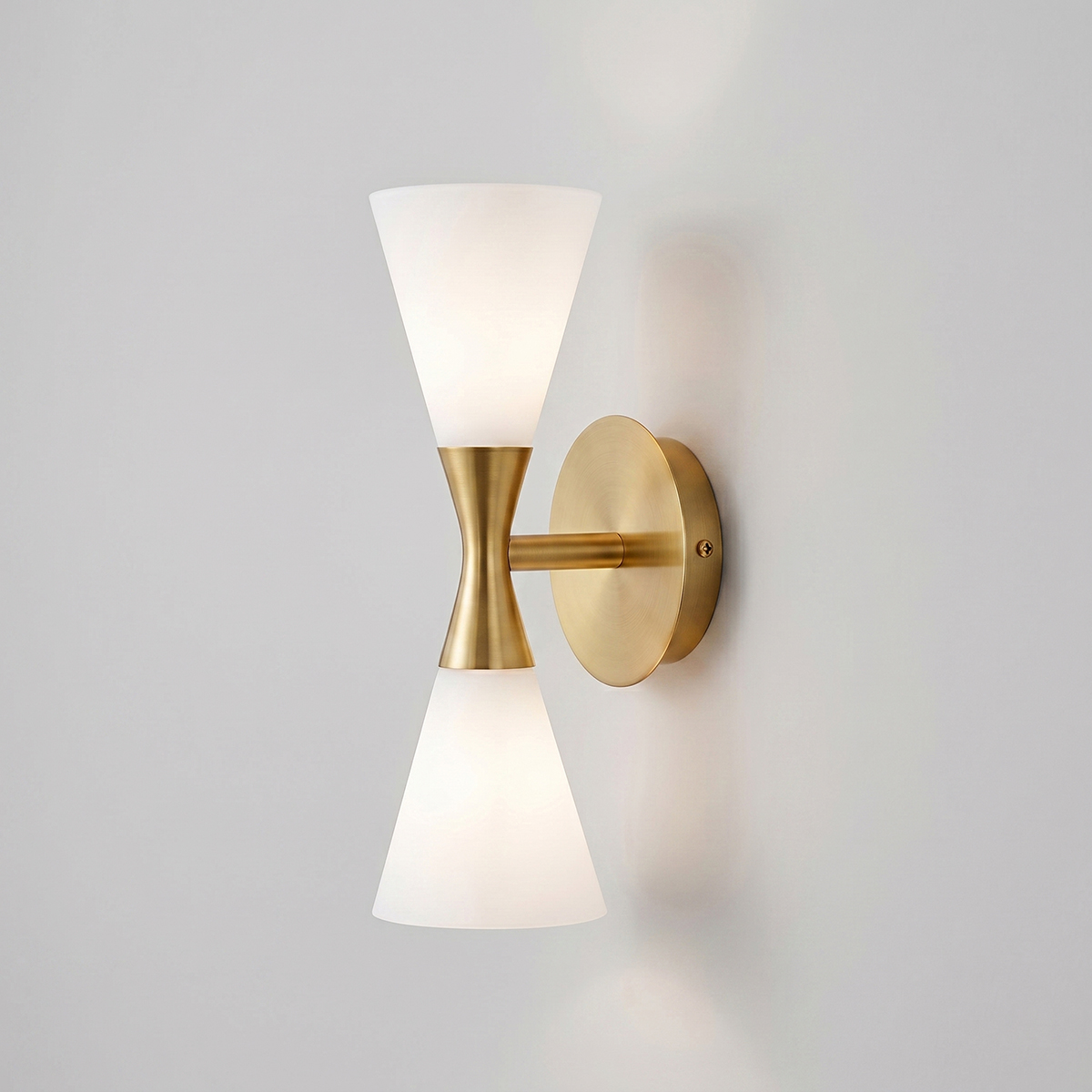 Mid-Century Modern Glass Wall Sconce 1 Mid-century modern 2-light hourglass wall sconce in brushed brass finish with frosted glass shades.