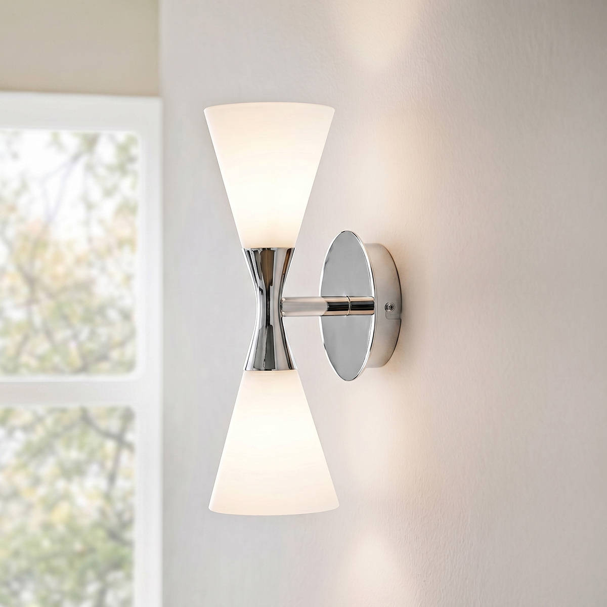 Mid-Century Modern Glass Wall Sconce 3 Contemporary 2-light hourglass vanity wall light in polished chrome finish with white glass shades.