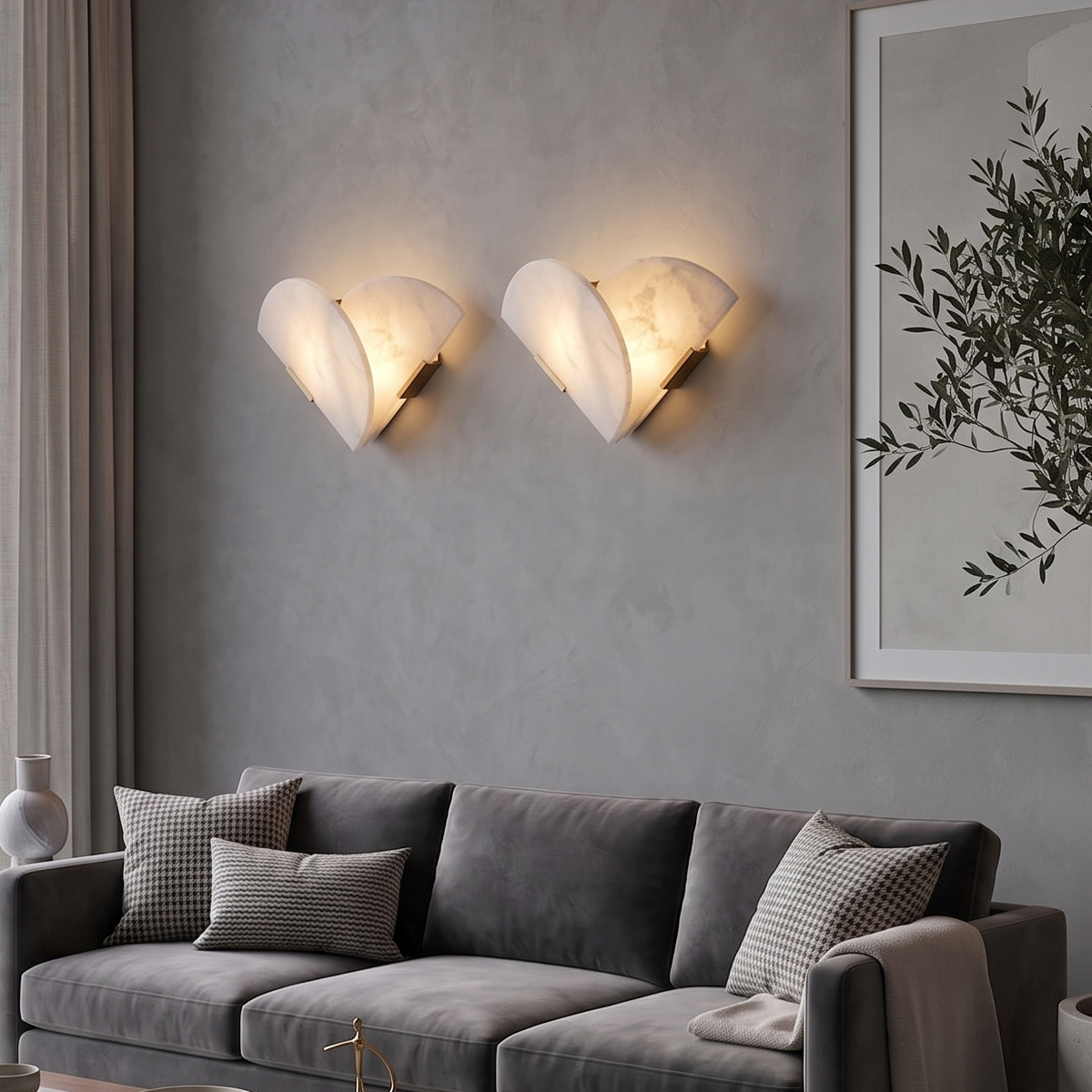 Modern Alabaster Wall Sconce 7 A pair of modern alabaster wall sconces installed above a gray sofa in a contemporary living room interior.