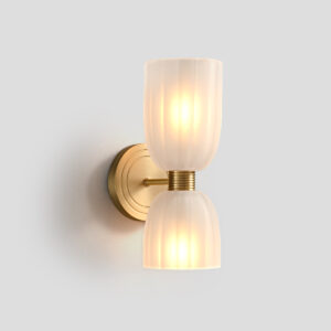 Front view of mid-century modern brass wall sconce with ribbed glass shades