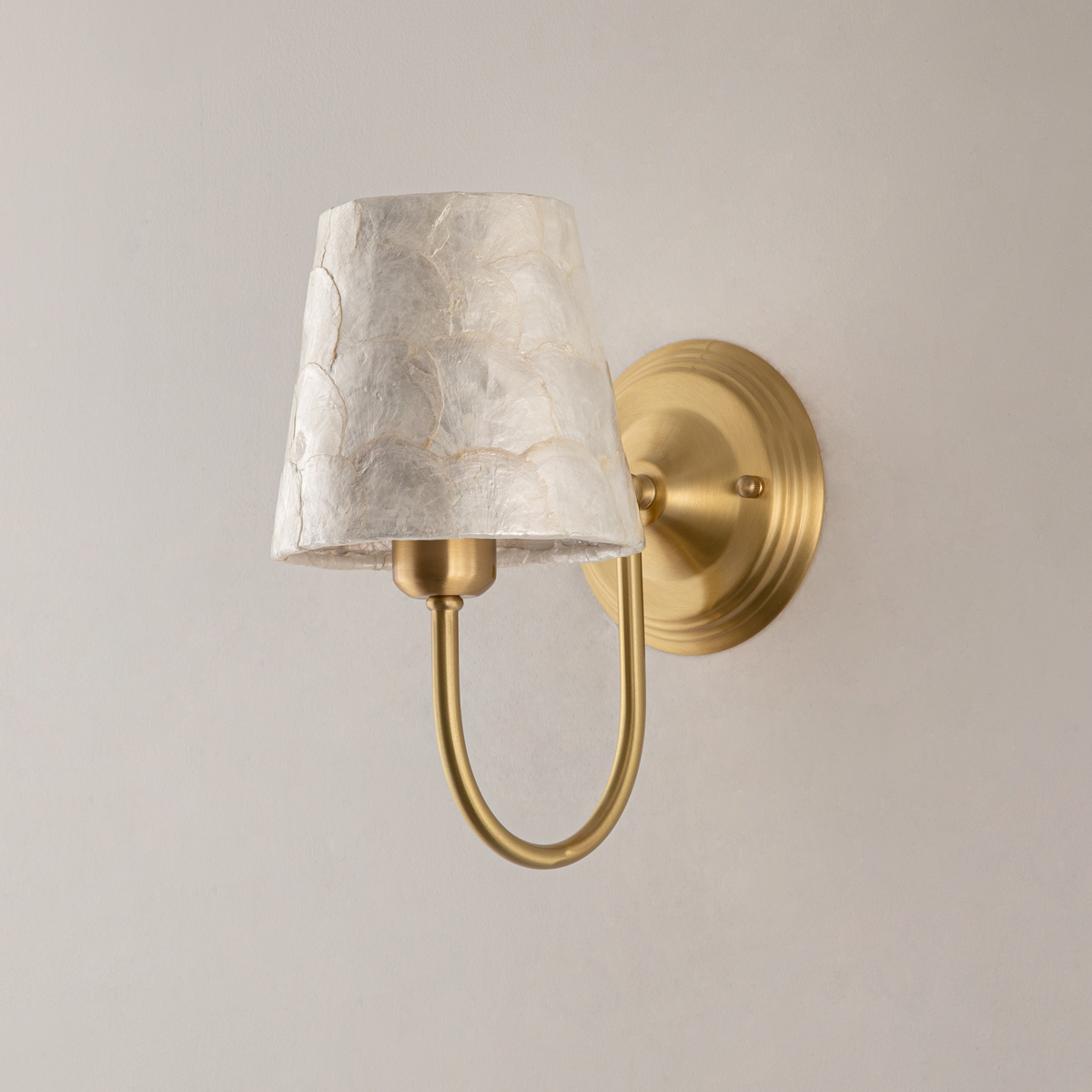 Modern Capiz Shell Wall Sconce 4 Off state of the brushed brass wall fixture with natural iridescent capiz shell shade.