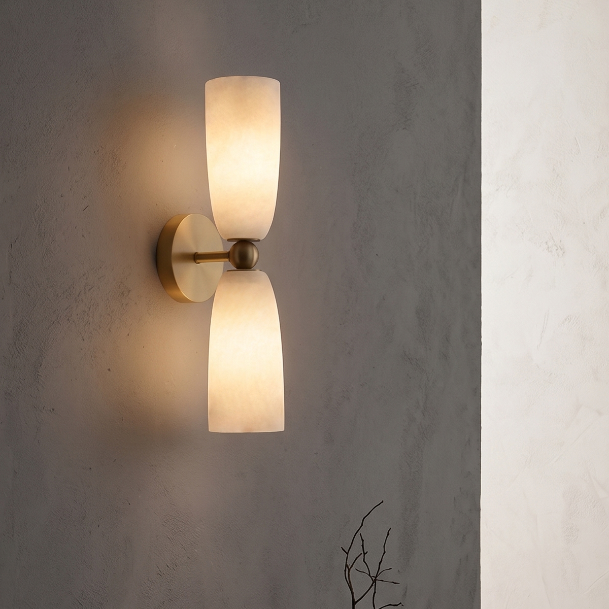 Modern Brass Frosted Glass Wall Sconce 6 Illuminated 2-light brass wall sconce casting a warm ambient glow in a dark room