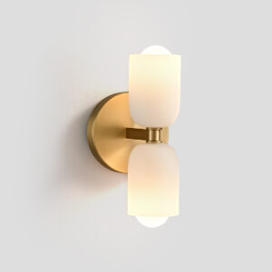 Front view of a modern brass wall sconce with dual frosted glass shades against a white wall.