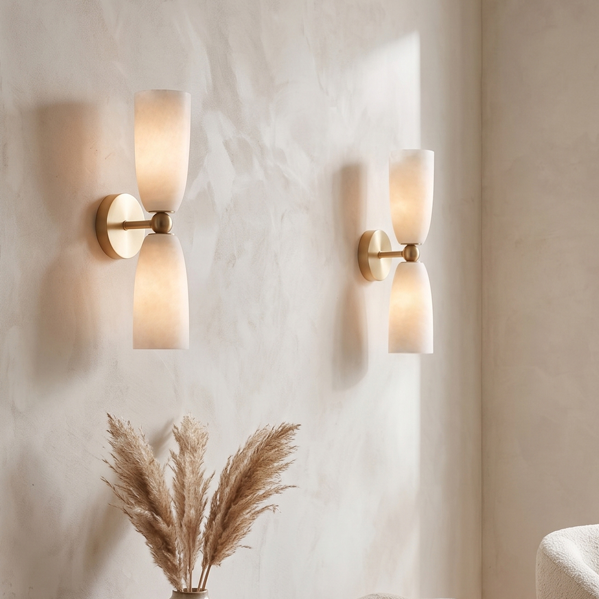 Modern Brass Frosted Glass Wall Sconce 7 A pair of modern brass 2-light wall sconces decorating a beige living room wall
